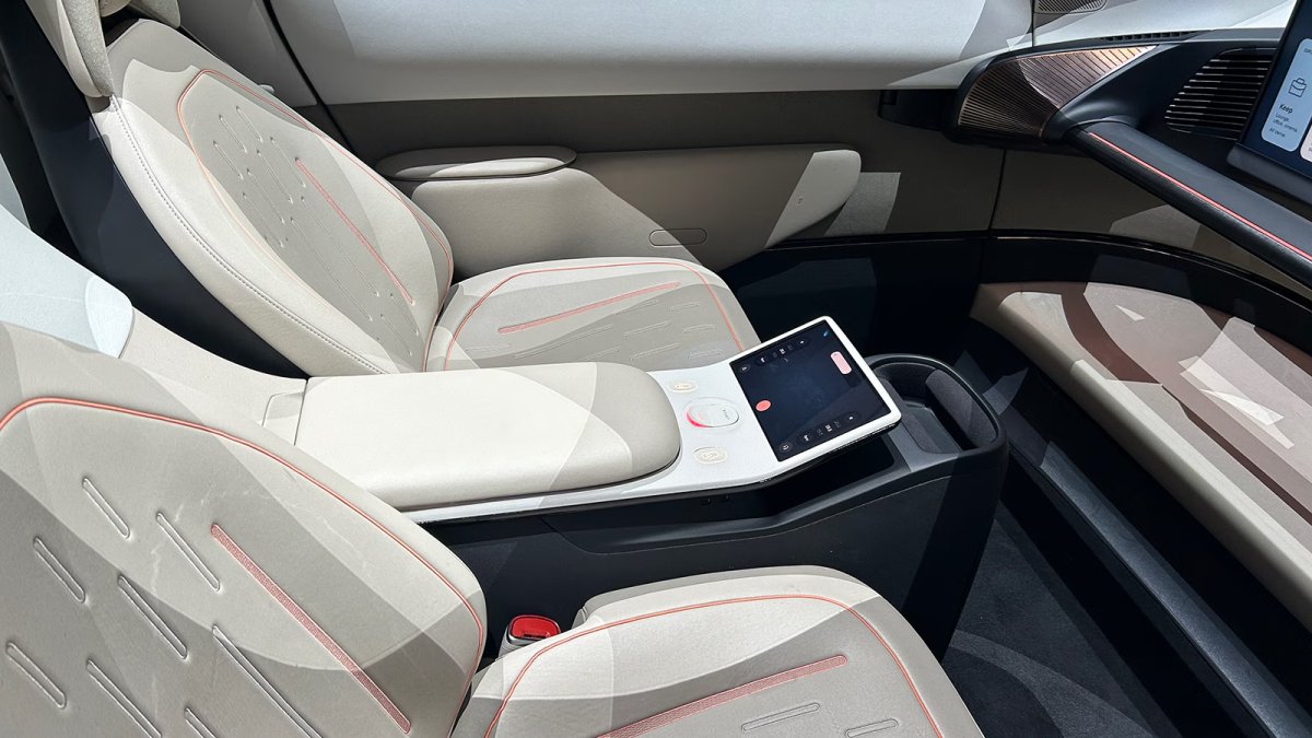 A smaller screen between the front seats lets you control certain aspects of the vehicle